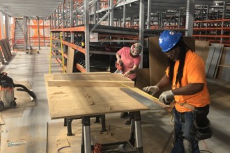 Male and female carpenters at work