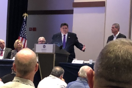 Governor Pritzker speaking at annual seminar