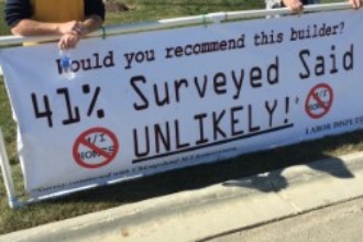 Picketers with sign